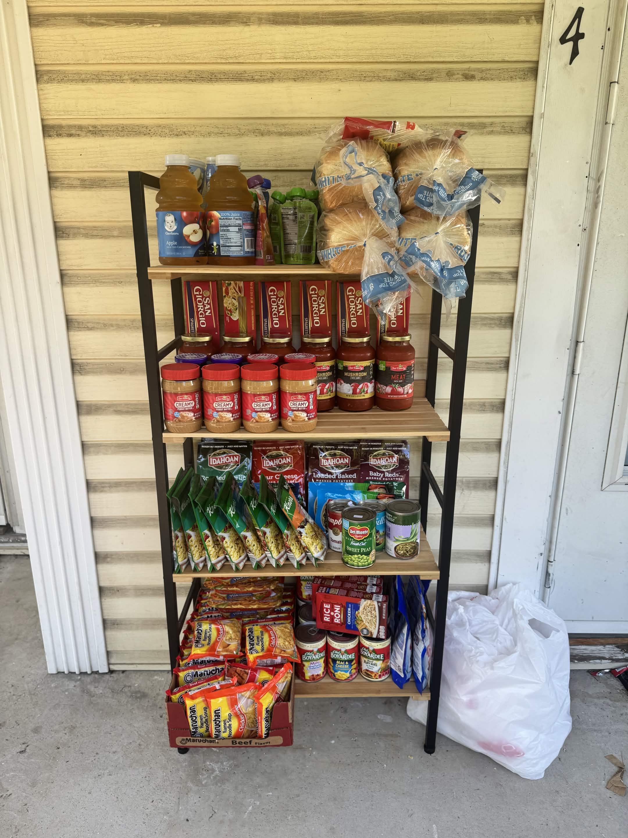 Community baker's rack stocked with free food at 314 Hancock Street