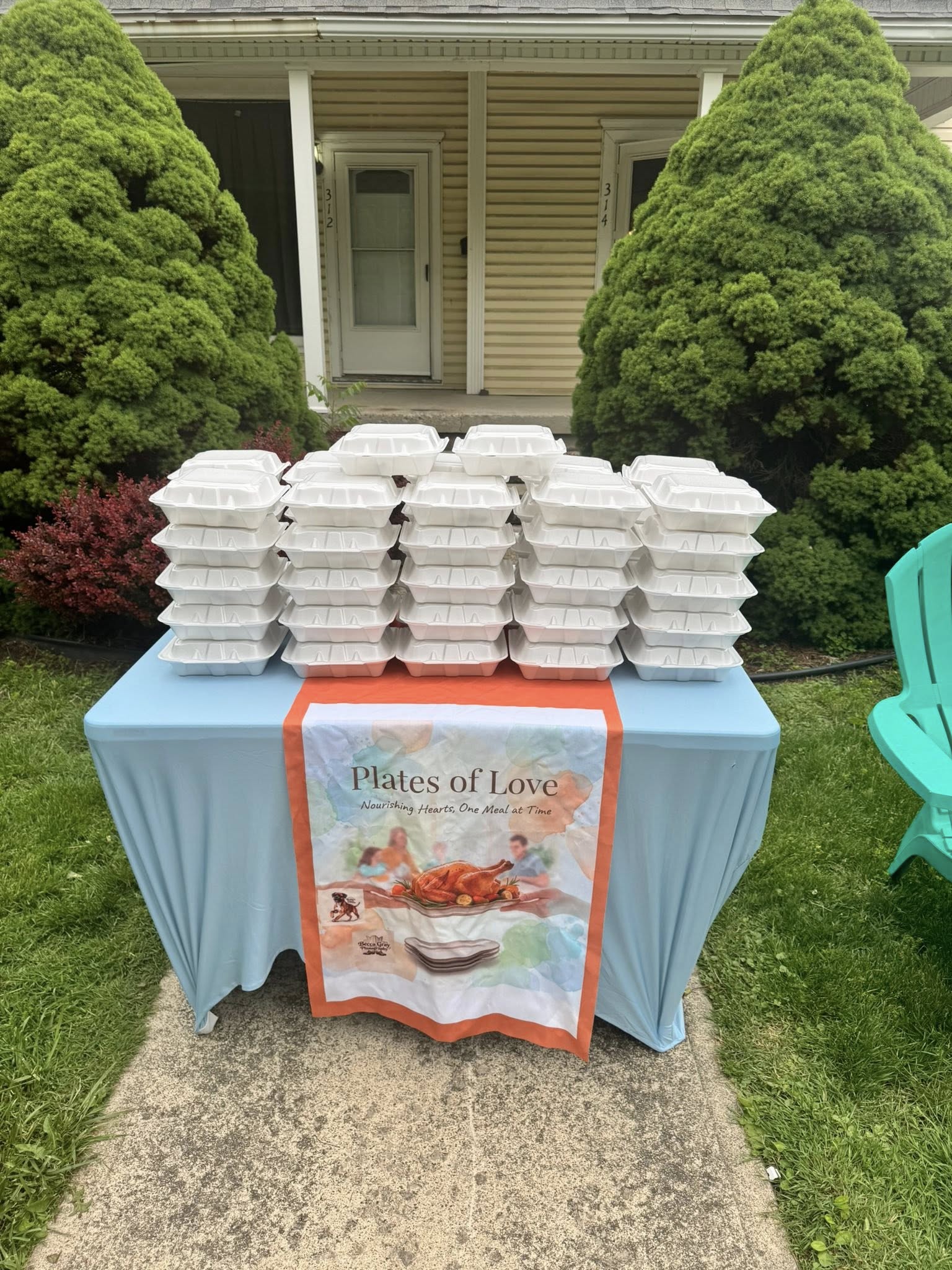 Plates of Love serving table loaded with meals